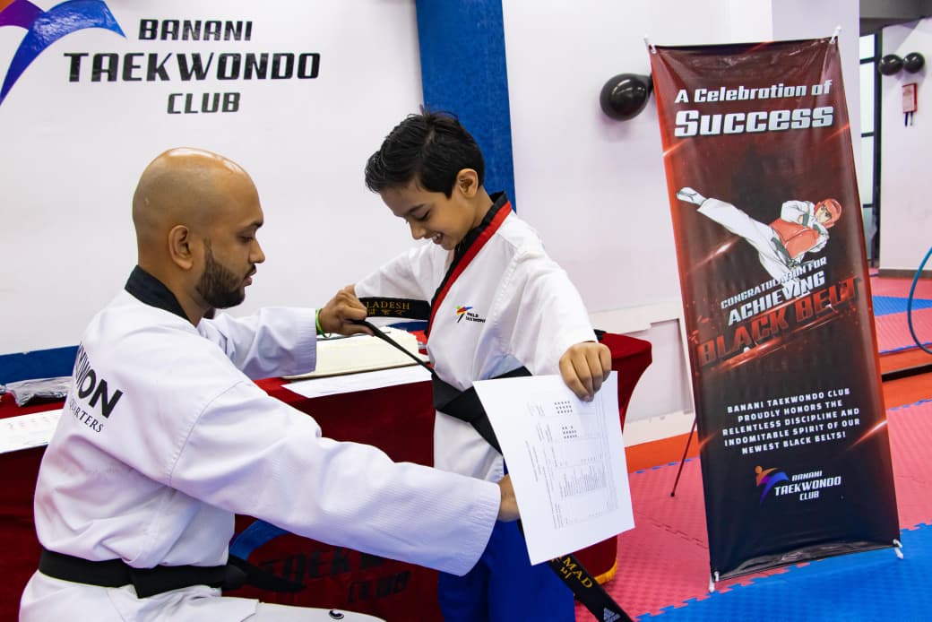 Master Nooruddin mentoring student athletes at Banani Taekwondo Club