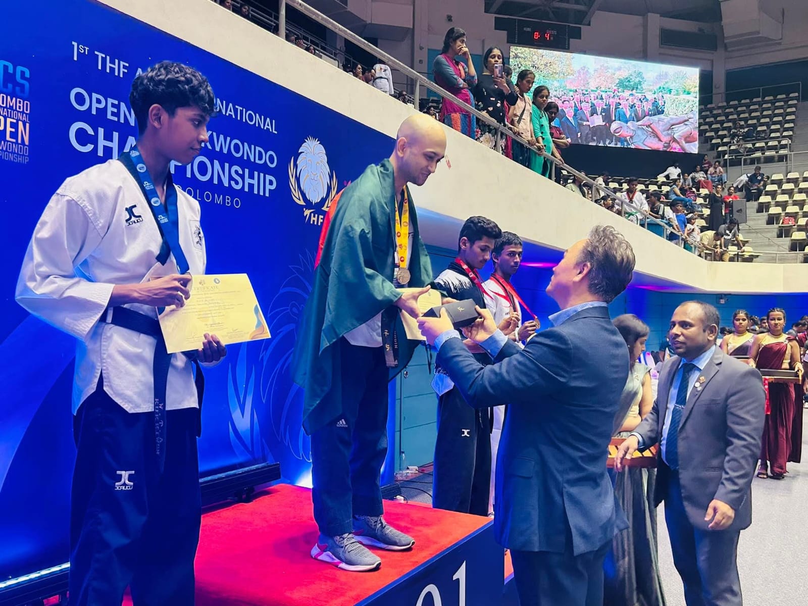Master Nooruddin Husain receiving medal from Grandmaster Kim In-seon